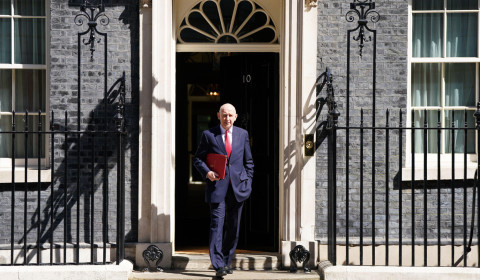 Image of the chancellor John Healy in front of Downing Street.