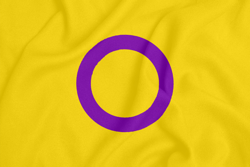 Intersex pride community flag on a textured fabric.
