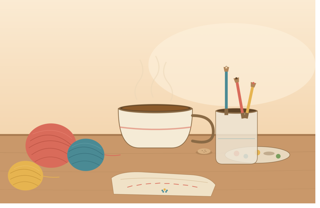 Coffee/tea cup. Red, blue and yellow balls of wool and a jar of pens