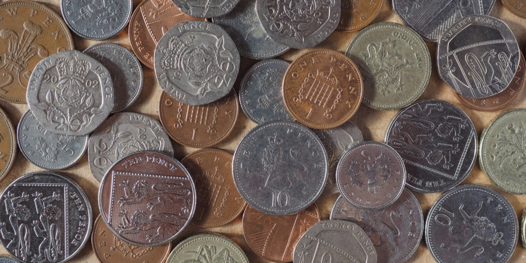Photograph of 10p, 20p, 1p, 2p and 5p coins scattered on a table