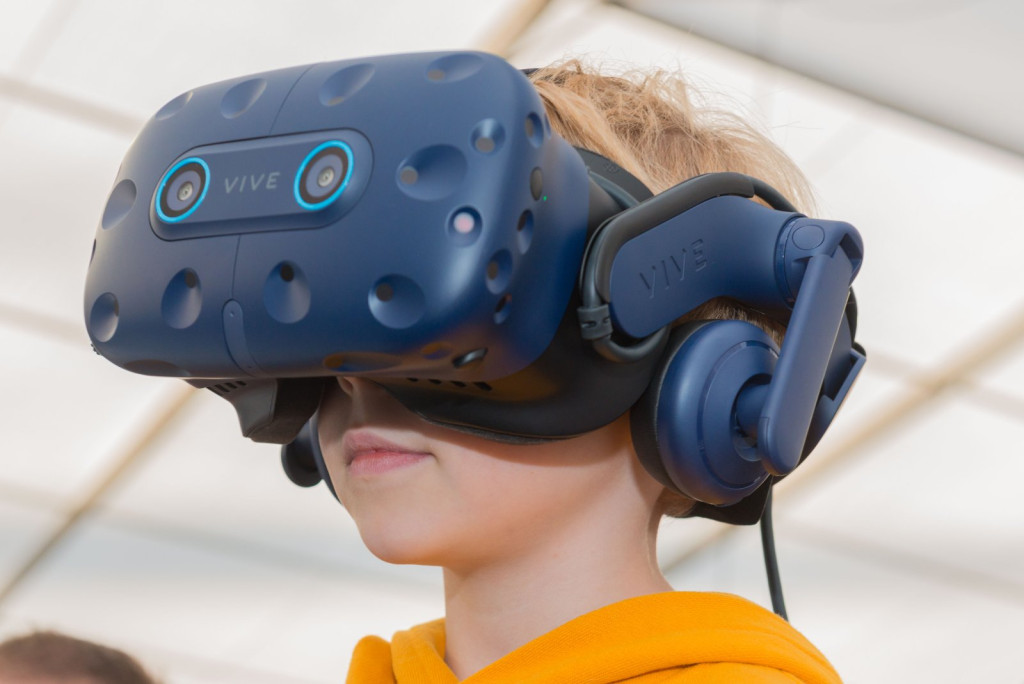 Image of a young boy wearing a virtual reality headset