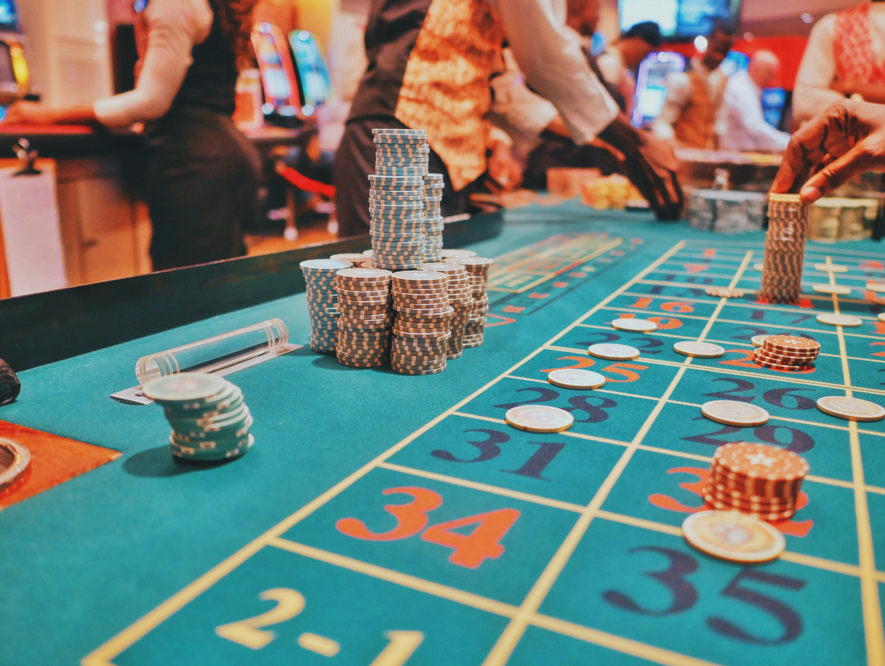 Casino-style gaming table with chips and betting spaces, representing an interactive activity that explores how gambling products influence decision-making and wellbeing