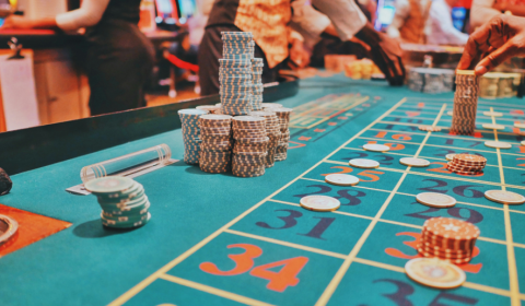 Casino-style gaming table with chips and betting spaces, representing an interactive activity that explores how gambling products influence decision-making and wellbeing