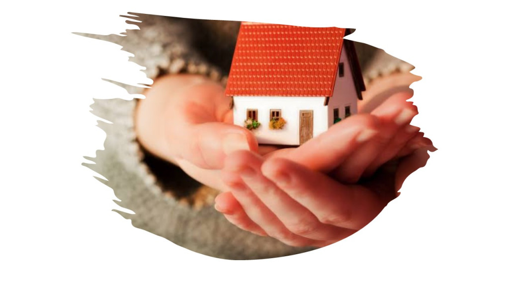 Hands holding a house