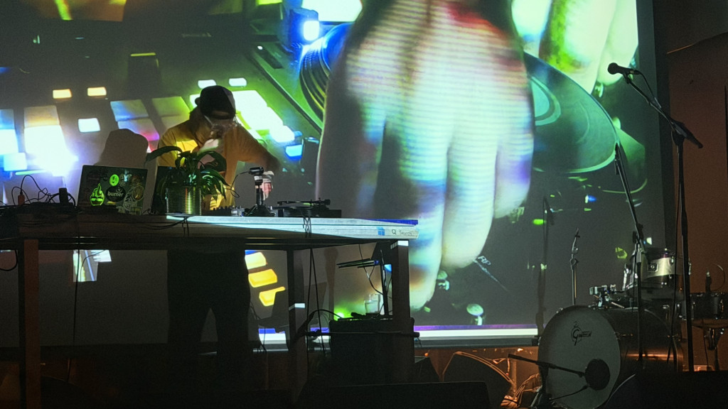 An event stage with background imagery and musical instruments