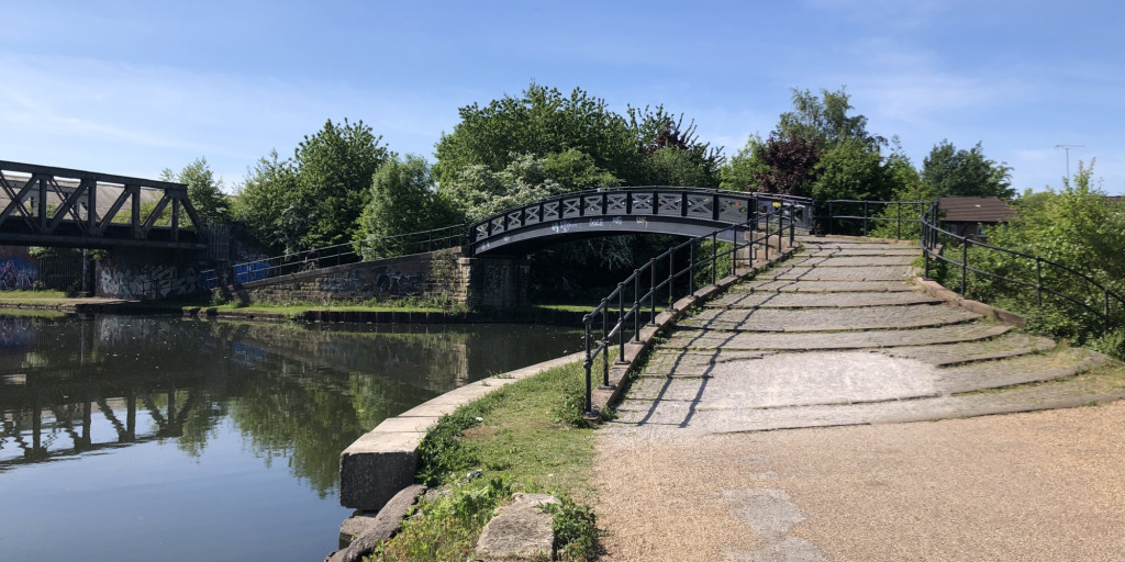 Photograph of a footpath and bridge over a river