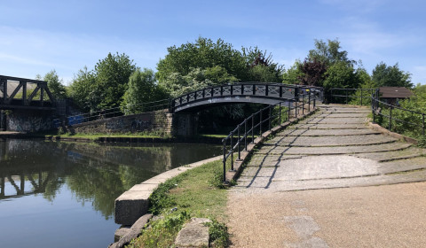 Photograph of a footpath and bridge over a river