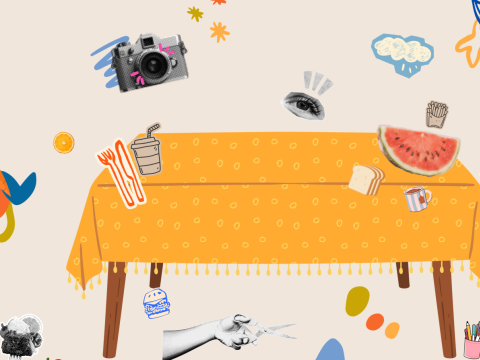 A dinner table displaying cut-out pictures of food and drinks, alongside scissors, demonstrating the process of making a collage.