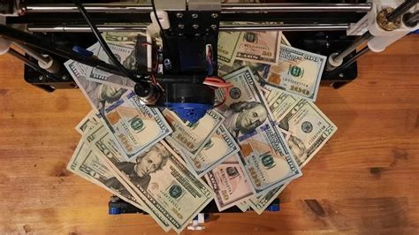 Paper money spread around a printer