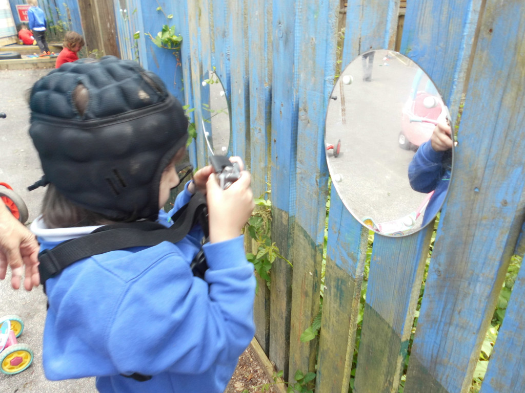 Child engaging with a reflective play space that supports movement and participation