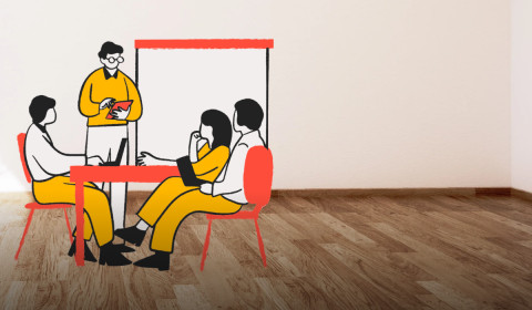 Animated image with 3 people sitting at a table and one person standing at the right hand side. On the left hand side is wiring in red in Irish 'An Ghaeilge agus na hEolaiochtai Soisialta' which means 'The Irish Language and Social Sciences'