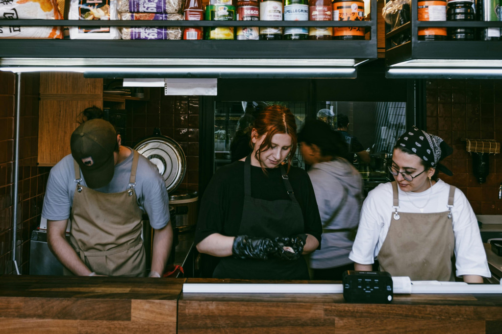 Photograph of young people working in a restaurant kitchen