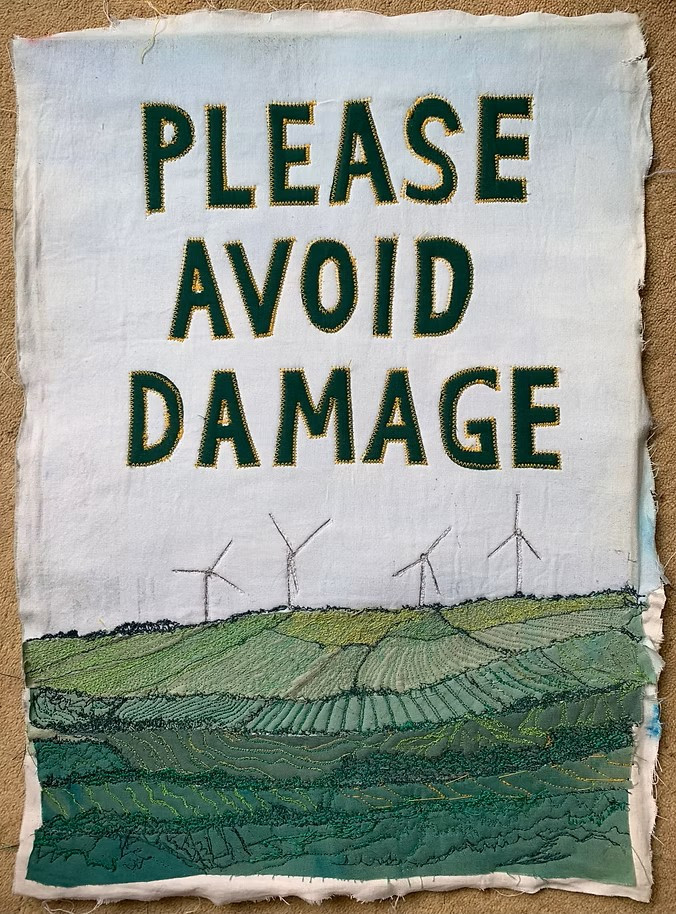 Wind turbines with a slogan - Please Avoid Damage