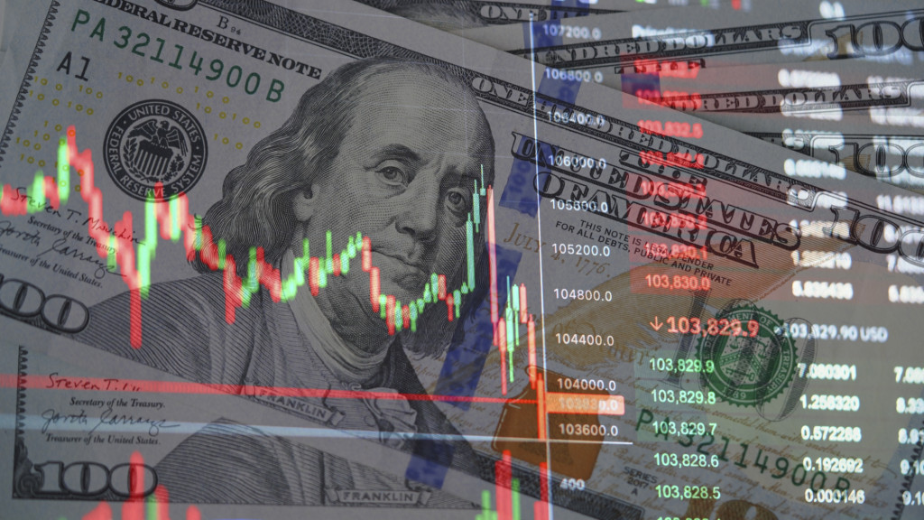 Image of stock market graphs, overlaid over images of bank notes