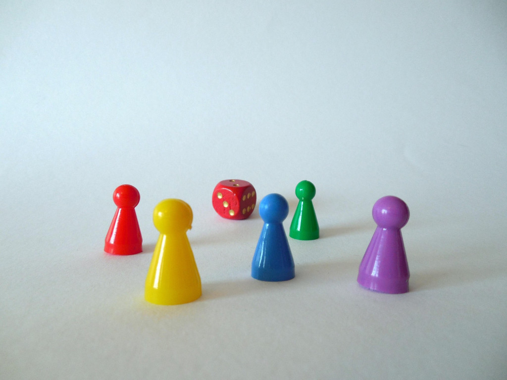 Image of a dice and characters from a table top game