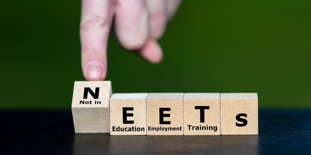 Someone moving the N spelling NEETs. Underneath the words are Not In Education Employment Training