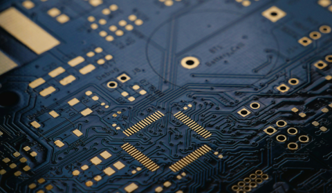 Image of a circuit board in black and gold