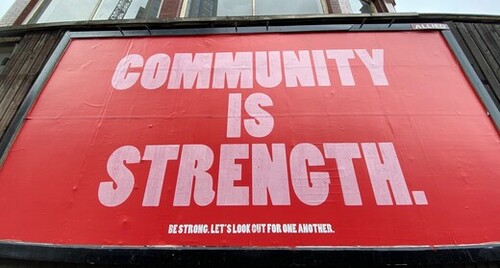 Poster saying Community is Stength